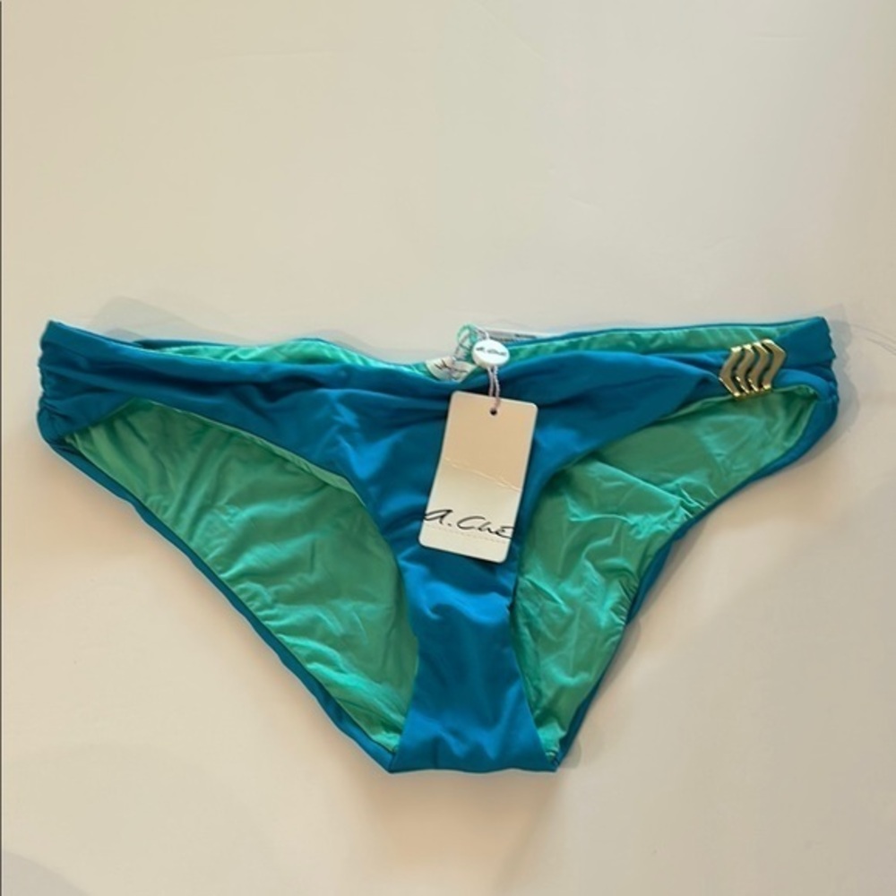 A. Che winslet hipster catalina blue bikini swim bottoms size small NWT